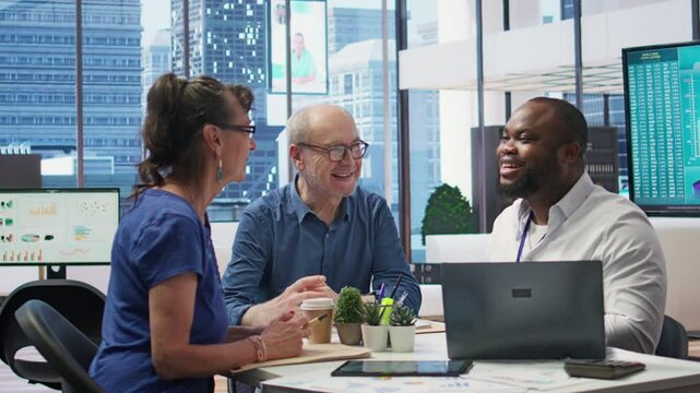 Old people discussing with a professional banker about retirement plans and life insurance options. Planning investments with money savings and pension, financial advice in modern office. Camera B.