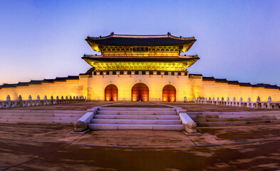 Jongno-gu, Seoul, South Korea - December 12, 2023: Front and night view of stone steps and entrance door of Gwanghwamun Gate with illumination at Gwanghwamun Square
