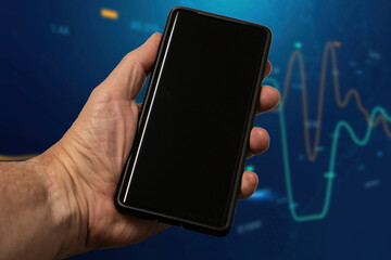 Mans hand holding cell phone with blank screen