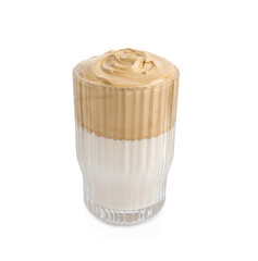 Glass of delicious dalgona coffee isolated on white