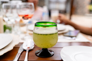 refreshing green drink in an elegant restaurant - mezcalina 