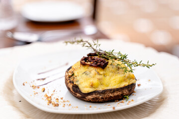 gourmet stuffed mushroom with cheese and herbs - side view