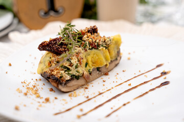 slice of gourmet stuffed mushroom with cheese and herbs
