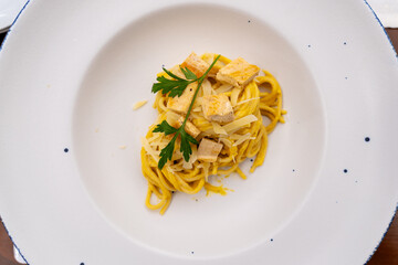 gourmet pasta with chicken and parmesan - top view