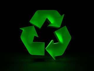 Fototapeta premium Green recycle symbol glowing on black background representing environmental awareness
