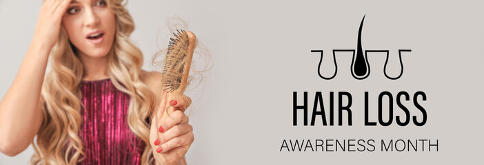 Worried woman with hair loss problem on light background