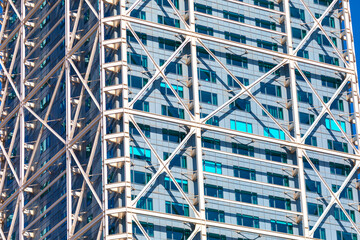 Fototapeta premium Building is made of metal and has a modern design. Majestic tall building with many windows in city center