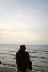 Shadow person in the beach with sunset