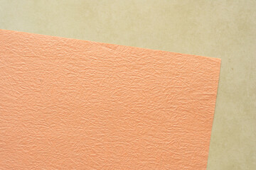 Fototapeta premium pastel orange and tan paper background