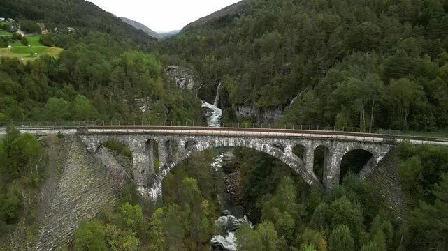 Scenic aerial reveal shot of Kylling railway bridge in Verma, Norway
