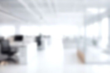 Obraz premium Blur open office with soft sunlight at big window for background usage. blur interior background concept. white and bright tone.
