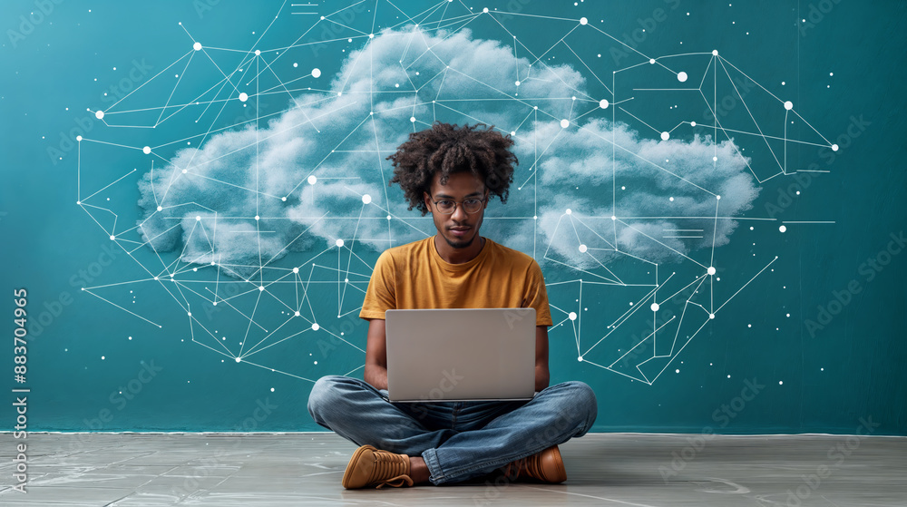Wall mural aerial view of a man sitting cross-legged and working at a laptop, with an abstract cloud and networ