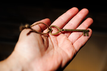 Heart Shaped Vintage Skeleton Key in Hand