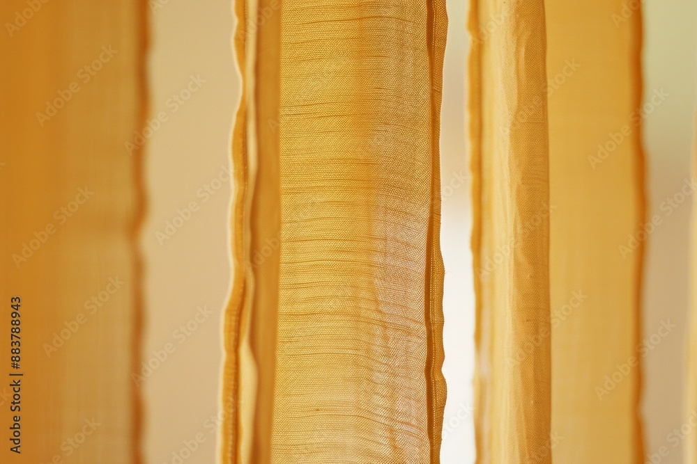 Poster symmetrical abstract textile design in mustard yellow and earthy orange tones captured with long exp