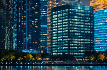 Obraz premium Urban skyscrapers in Shanghai at night; 
