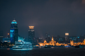 Naklejka premium Urban skyscrapers in Shanghai at night; 