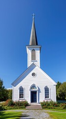 A picturesque white wooden church with a tall steeple set against a clear blue sky, surrounded by lush greenery.