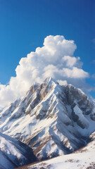 Obraz premium Snowy mountain against blue sky 