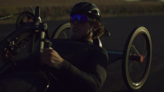 Para Athlete cycling on the road