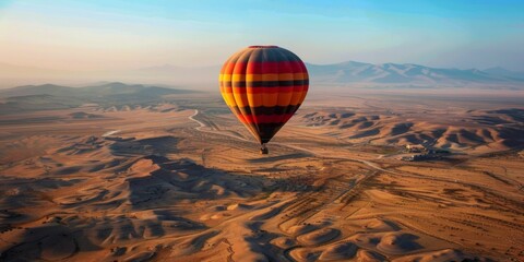 Obraz premium Hot Air Balloon Soaring Over Desolate Landscape