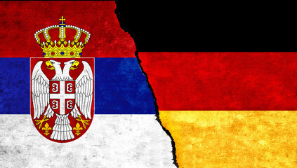 Obraz premium Serbia and Germany flags together on wall. Germany Serbia relations, economy, relationship, trade concept