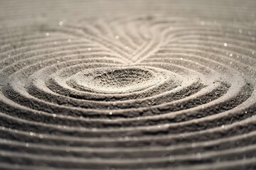 Naklejka premium A circle in the sand. Zen Japanese garden. Background.