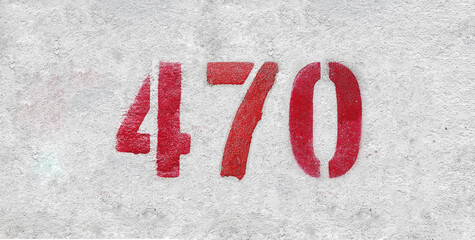 Red Number 470 on the white wall. Spray paint.
