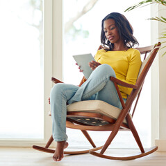 Portrait, black woman and chair for relax with tablet, home or online for social media or ebook....
