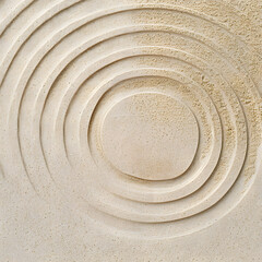Naklejka premium Circle lines on sand, beautiful sandy texture. Natural sand background for spa wellness, concept for relaxation balance and harmony. Concentration and spirituality in Japanese zen garden