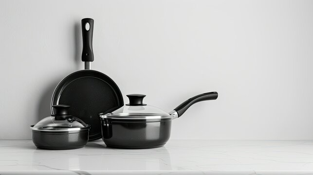 Stylish cookware set on pure white background, elegant and modern kitchen essentials