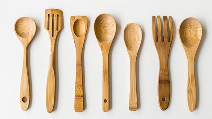 Assorted bamboo kitchen utensils against pure white, eco-friendly and modern