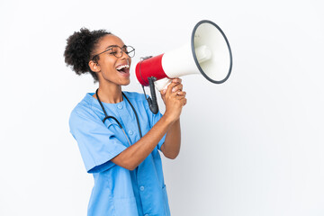 Young surgeon African American doctor woman isolated on white background shouting through a megaphone