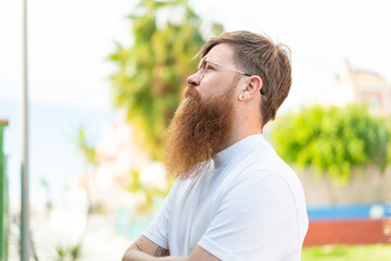 Redhead man with beard With glasses