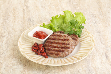 Grilled beef burger cutlet with sauce