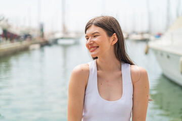 Young pretty woman at outdoors With happy expression