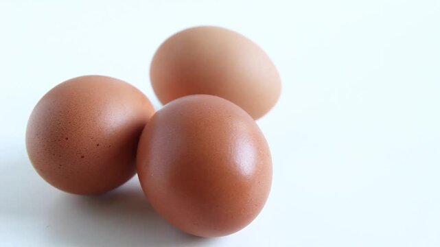 rack focus on three eggs