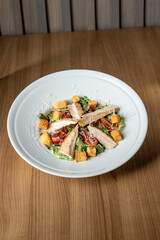 Caesar salad with grilled chicken breast