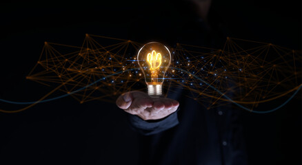 Solution or creative idea for designing a web banner or landing page for an innovative company with a hand sticking out of the screen with a light bulb. Famous abstract geometric shapes and lead lines