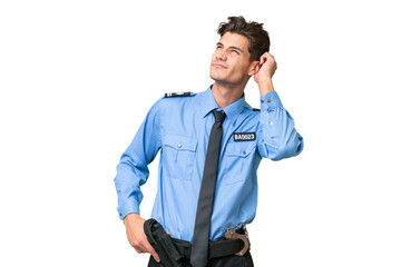Fototapeta premium Young police man over isolated background having doubts and with confuse face expression