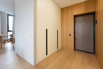 Stylish hallway with wooden furniture