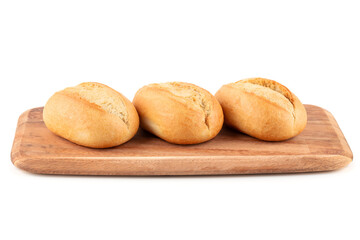 Bread rolls on wooden board