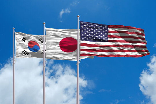 Flags of South Korea, Japan and USA - Powered by Adobe