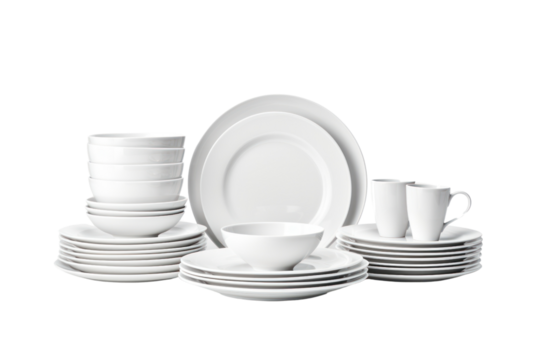 A classic white ceramic dinnerware set with plates, bowls, cups, and saucers. Isolated on white background