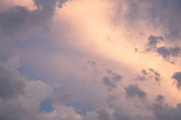 Clouds at sunset. Pink and yellow big clouds at sunset