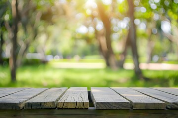 Wooden tabletop in a sunny park with a blurred, green background