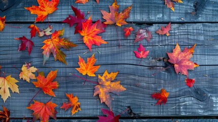 autumnal leaves on wooden background 