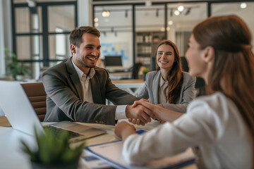 Fototapeta premium Business Meeting with Happy Mood, Three People Shaking Hands in Modern Office