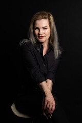 woman in black on a black background