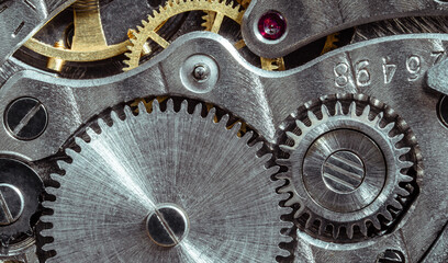 Ancient tiny metal clockwork close up background