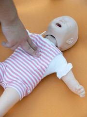First aid training - mastering CPR techniques on a dummy